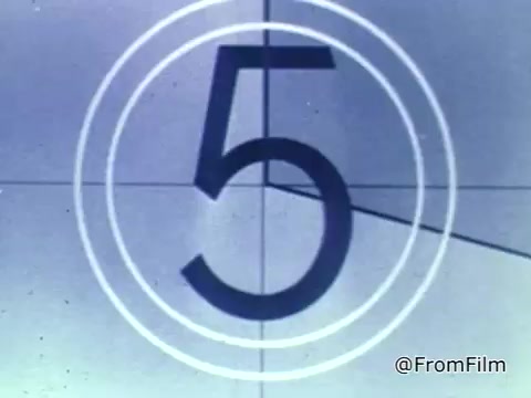 The still features a vintage film countdown, showing the number '5' prominently in a circular frame. The background is likely a muted color, typical of 16mm film from that era. The countdown suggests the beginning of a Public Service Announcement (PSA) by the National Foundation of the March of Dimes from 1975.