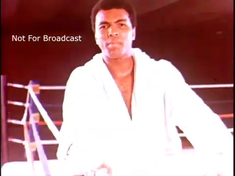 The still features Muhammad Ali in a boxing ring, wearing a white robe and appearing confident, as he addresses the audience. The background suggests a boxing environment, emphasizing Ali’s iconic status. The overlay text indicates that the image is for internal use only and not meant for broadcast. The setting and Ali’s demeanor suggest a motivational message linked to multiple sclerosis awareness.