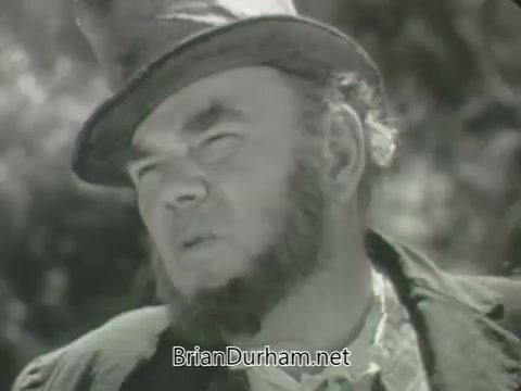 The still features a rugged, bearded man wearing a wide-brimmed hat, likely portraying a character from a classic Western or rural setting. His expression appears serious or contemplative, suggesting a moment of introspection. The black-and-white format adds a vintage feel, typical of early television promos like those from ABC in the fall of 1963. The background is blurred, focusing attention on the character's face and attire.