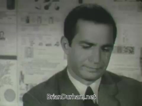 The still features a man in a suit looking downward, conveying a serious or contemplative expression. The background consists of various printed materials, possibly promotional content for the ABC network's fall 1963 season. The overall tone appears formal, indicative of the promotional style typical of that era.