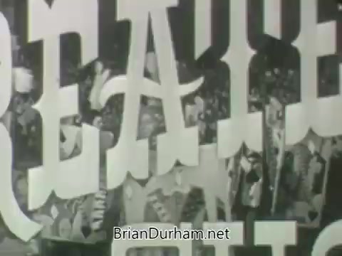 The 16mm still from 'ABC Fall 1963 season promos' features bold, stylized lettering that likely emphasizes the excitement of the programming for that season. The image captures a lively atmosphere, possibly with a performance or celebration in the background, hinting at a blend of entertainment and promotional content typical of network advertisements from that era.