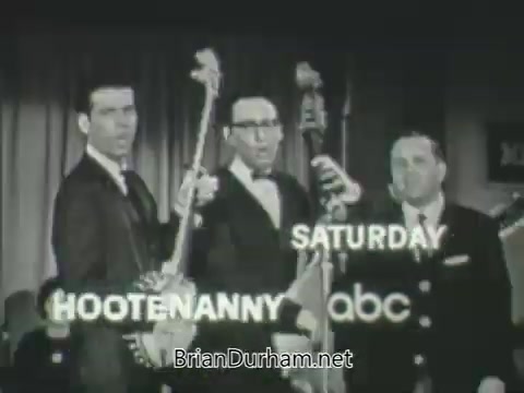 The still from the 'ABC Fall 1963 season promos' features three musicians posing with their instruments, likely showcasing a musical performance. The text on the image highlights 'Hootenanny' scheduled for Saturday on ABC, indicating its promotional nature. The overall tone is vintage, reflecting the style of televised entertainment from the early 1960s.