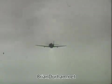 The still from the 'ABC Fall 1963 season promos' features a vintage airplane flying through a cloudy sky. The aircraft is depicted from a low angle, suggesting a sense of motion as it ascends or descends. The overall atmosphere is nostalgic, indicative of the era's promotional style.