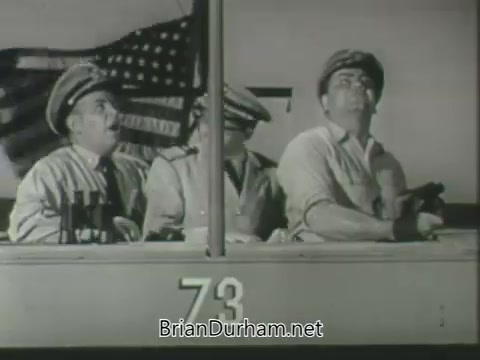 The still features three men in a boat, likely engaged in a comedic or dramatic moment, set against a backdrop that includes an American flag. The men are dressed in military-inspired uniforms, suggesting a maritime or naval theme. The focus on their expressions indicates a moment of surprise or concern, adding to the humorous or engaging tone of the promo for the ABC Fall 1963 television season.