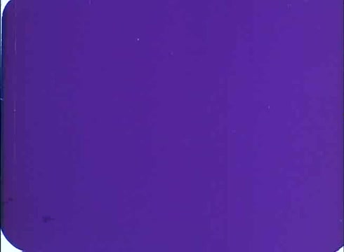 The still features a solid purple background typical of 16mm film prints, possibly representing a stylized title card or transition. The image is devoid of detail or figures, focusing solely on color.