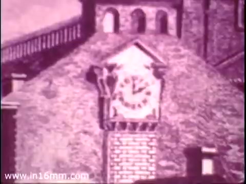 The still from the 'Bicentennial Youth Debates - PSA from 1975' features a clock on a building, emphasizing themes of time and history. This image serves as a backdrop for a program aimed at engaging youth in national conversations, facilitated by the Speech Communication Association with support from the National Endowment for the Humanities. The initiative focused on modern issues relevant to American society, encouraging young people to participate in civic dialogue.