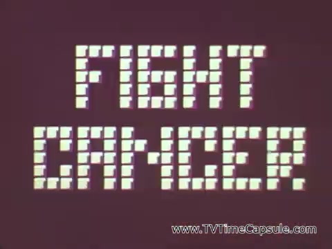 The still from the American Cancer Society PSA features a bold, graphic text that reads 'FIGHT CANCER' in a pixelated font against a simple background. This visual emphasizes the campaign's urgent and action-oriented message. Walter Schirra, the astronaut, speaks about the importance of vigilance and regular checkups, likening them to the extensive preparation required before a space launch, underscoring the need for awareness and proactive health measures.