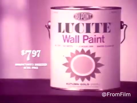 The still features a can of DuPont Lucite Wall Paint prominently displayed against a subtle pink background. The can is labeled clearly, showcasing the brand name 'Lucite' in bold letters at the top, with 'Wall Paint' beneath it. The price of $7.97 is highlighted in a larger font, emphasizing its value. A decorative sunburst graphic, possibly symbolizing color options, surrounds the can. Overall, the image conveys a classic 1970s aesthetic, aimed at promoting the product for home improvement.   For more content, subscribe, like, or follow us on Twitter @FromFilm.