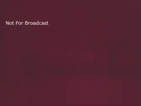 The still likely features a simple yet eye-catching design typical of 1970s public service announcements, with a strong emphasis on bananas as a healthy snack. It may include vibrant colors and engaging graphics aimed at busy individuals, promoting the idea of incorporating nutritious food into a hectic lifestyle. The text 'Not For Broadcast' suggests it's intended for restricted viewing, possibly for training or archival purposes.