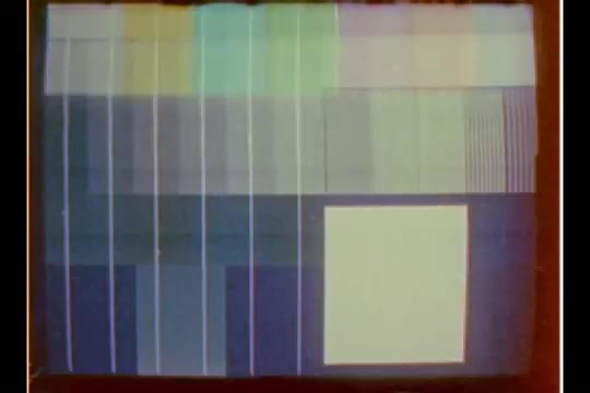 The still appears to be a test pattern or a color calibration image rather than an actual scene from the CBS news story. It features various blocks and stripes in different shades and colors, typically used to check the image quality and color accuracy of video equipment. This type of image is often found in archival footage but does not capture the content of Bill Plante's report about technology in department stores during the holiday season.