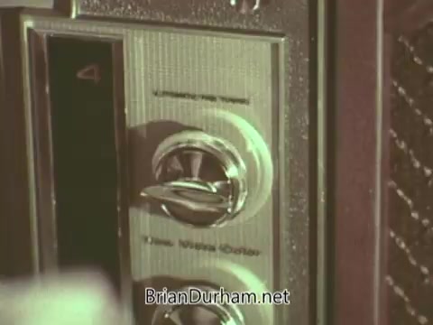 The still depicts a close-up of a vintage radio or television set from the 1960s. The control panel features a rotary dial and buttons, emphasizing the technology of the era. This image likely serves to evoke nostalgia and highlight the medium of communication used in the Episcopal Church's public service announcement.