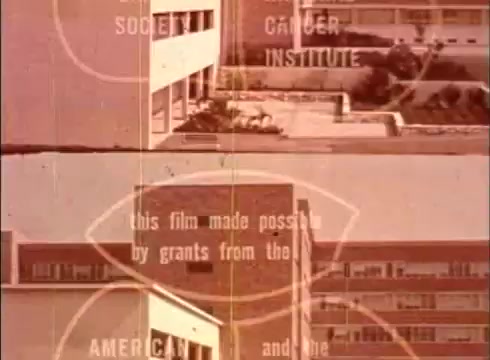 The still features a vintage educational film frame showcasing a caption highlighting funding sources, specifically mentioning the American Cancer Society and the Cancer Institute. The scene appears to depict an exterior view of a building, likely related to medical or scientific research. The overall aesthetic reflects a mid-20th century film style, typical of educational films of that era.