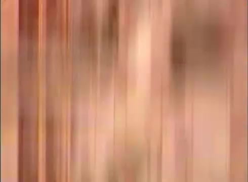 The still appears to be a somewhat blurred or distorted image, likely a result of the aging or projection quality of a 16mm print. It may depict a visual associated with the educational themes of 'The Human Cell and the Cytologist,' potentially conveying cellular structures or processes. The colors may have a warm tone, suggesting a focus on the biological aspects of human cells.