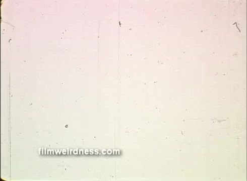 The still appears to be a blank frame from a 16mm print of the 1976 USA Bicentennial PSA. The image is likely characterized by faded colors and visible film grain, typical of older film stock. There may be scratches and dust marks, suggesting wear over time, and reinforcing the nostalgic quality of the bicentennial era.