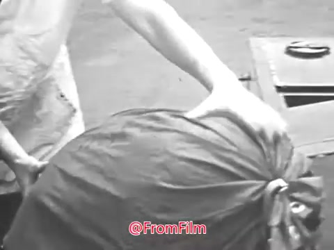 The still from 'Don't tie up mail service - use zip code - 1968' depicts a person handling a large, tied-up bag, likely filled with mail or packages. The emphasis is on the importance of using a zip code to ensure efficient mail delivery. The black-and-white imagery reflects the era, reinforcing the public service message promoted by the Ad Council.