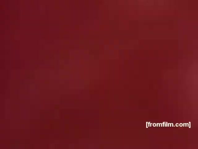 The still appears to feature a solid, rich background color, possibly red, characteristic of many vintage advertisements. In the context of the Souza Cruz Brazilian cigarette commercials from the 1970s, this style may have been used to evoke feelings of passion, boldness, or sophistication, aligning with the branding of cigarettes like Albany and Richmond. The simplicity of the image likely emphasizes the brand's name or logo that would be prominent in a full commercial.