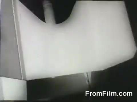 The still depicts a portion of the USS Hornet's flight deck, focusing on the launching mechanism utilized for the B-25 bombers during the Doolittle Raid on April 18, 1942. The angle suggests a behind-the-scenes view of the aircraft preparation and launch process. The scene conveys the tension and strategic operations involved in the historic military mission.