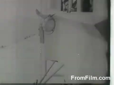 The still likely captures a moment of preparation or activity aboard the USS Hornet during the Doolittle Raid. It showcases the B-25 bombers and the crew's efforts as they get ready for their launch. The image may feature aircraft components or personnel, emphasizing the historical significance of this military operation on April 18, 1942.