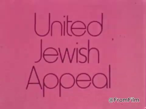 The still features the text 'United Jewish Appeal' displayed prominently against a pink background. The design is simple and emphasizes the message of the organization, suggesting a focus on community support and fundraising efforts, likely in the context of a public service announcement promoting charity and sharing.