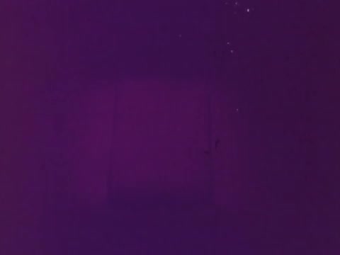 The still features a purplish background with a soft, blurred rectangular shape at the center, likely representing a mattress. The overall tone is calming, aligning with the theme of comfort promoted in the Beautyrest Mattress commercial.