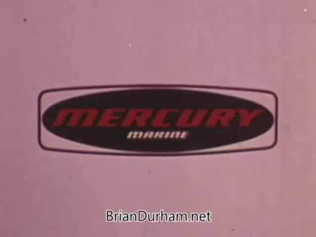 The still features the 'Mercury Marine' logo prominently in a bold, red font against a pink background. The design emphasizes a retro style typical of the 1960s, suggesting a focus on reliability and innovation in outboard engines. The image likely aims to evoke a sense of nostalgia and brand recognition for Mercury's marine products.