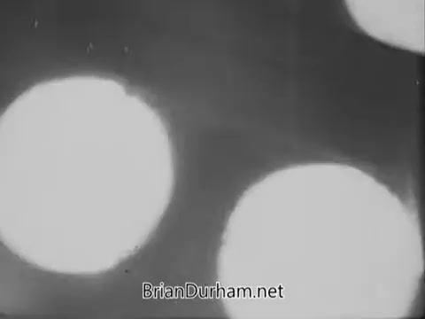 The still from the 1967 PSA by the National Council on Alcoholism features blurred, circular light sources, likely representing a symbolic or abstract depiction of alcohol-related themes. The monochromatic black-and-white presentation adds to the serious tone of the message, emphasizing the gravity of alcoholism awareness. The blurred effect may suggest confusion or impairment often associated with alcohol use.