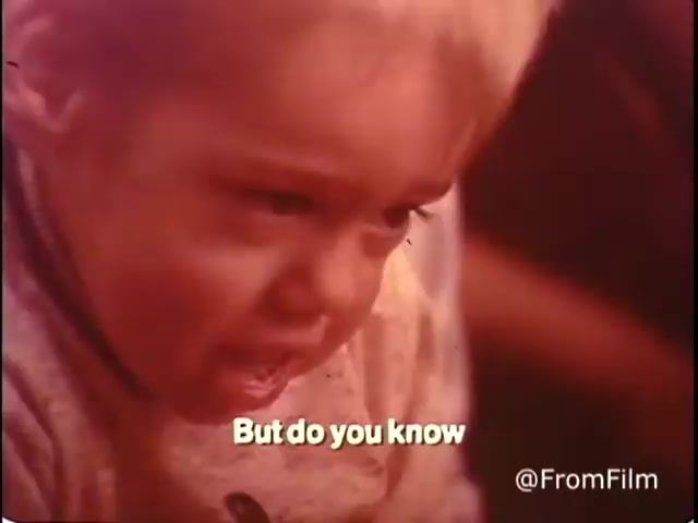 The still from 'Closer Look - 1970's PSA Parents' Campaign for Handicapped Children and Youth' features a young child with an intense expression, seemingly deep in thought or emotion. The text overlay reads, 'But do you know,' prompting reflection or engagement with the audience. The warm tones of the image evoke a nostalgic feel typical of the era. This PSA aims to raise awareness about the experiences and needs of handicapped children and youth.   Follow us on Twitter @FromFilm.