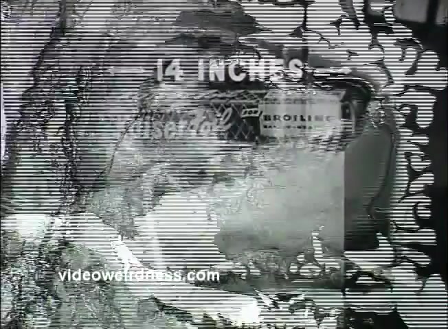 The still from the 1950's Kaiser Broiler Aluminum Foil Commercial features a visual advertisement emphasizing the product's utility in meal preparation, particularly for Thanksgiving. The image displays the specifications of the aluminum foil, prominently showing '14 INCHES,' alongside visuals suggesting cooking or wrapping food. The aesthetic reflects the mid-century commercial style, likely aimed at promoting convenience for homemakers during holiday meal prep. The print quality shows typical characteristics of 16mm film, with some graininess and a vintage feel.