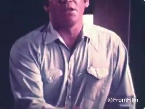 The still from the 'Roman Meal Bread Commercial' from the 1970s likely features a man in a light-colored shirt, possibly engaging in a conversation or demonstrating something related to the product. The commercial likely emphasizes the health benefits and quality of Roman Meal's whole-grain products, aligning with the brand's focus on nutritious offerings. The visual style typical of that era may include warm tones and a simple, direct presentation aimed at conveying trust and familiarity with the audience.