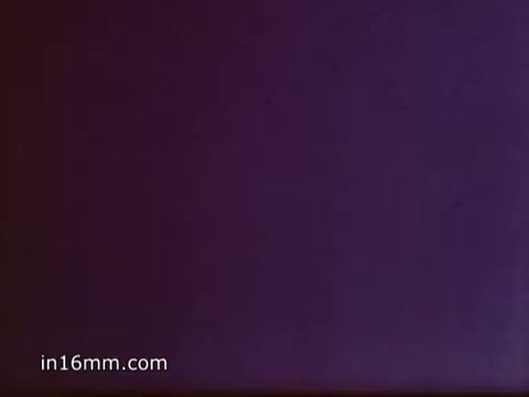 The 16mm still from the 'Bubble Up Soda' commercial features a simple, vintage aesthetic typical of the 1970s. The voice-over emphasizes Bubble-Up's refreshing qualities, contrasting it with 7-UP. With a catchy tune, the slogan promotes its lemon-lime flavor, inviting viewers to choose Bubble-Up for a tangy, thirst-quenching experience. The visual likely reflects bright colors associated with retro soft drink advertisements, enhancing its nostalgic appeal.