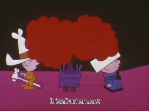 The still from the 1967 animated recruiting PSA for the US Navy features two cartoon characters dressed in distinctive outfits, one with a rabbit and the other with a large cart resembling a ship. The background is a simple, colorful design, enhancing the playful and whimsical tone of the animation. The characters seem to be engaged in some form of activity, likely connected to the promotional message of the PSA.