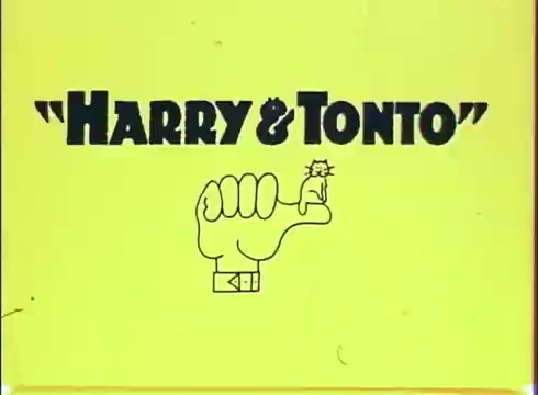 The still features a bright yellow background with the title 'HARRY & TONTO' prominently displayed. Above the text, there is a graphic of a hand forming a fist with a small cat perched on the thumb. The design is simple and playful, reflecting the lighthearted nature of the film, which stars Art Carney.