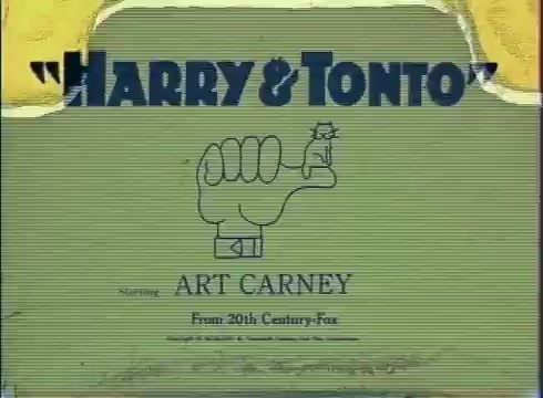 The still features the title 'HARRY & TONTO' prominently displayed in bold lettering, accompanied by a playful illustration of a fist with a small character on top. Below, it notes 'Starring ART CARNEY' and indicates the film is from 20th Century Fox. The overall aesthetic reflects a vintage 16mm print quality, with a slightly worn and textured appearance.