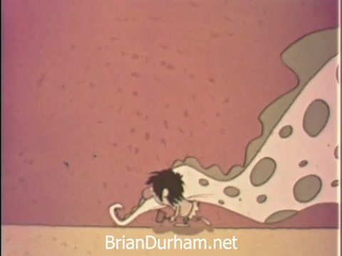 The still from the 1968 American Medical Association PSA features an animated character resembling a small, scruffy creature. It is depicted walking with a large, flowing cape decorated with polka dots. The background is simple and features a muted color palette, enhancing the whimsical yet educational tone typical of public service announcements from that era. The animation likely conveys a health-related message in a lighthearted manner.