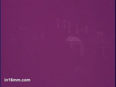 The still appears to be heavily tinted in a purple color, obscuring specific details of the visual composition. It likely features elements relevant to a Jergens Lotion commercial, but the lack of clarity makes it difficult to discern any particular imagery or context from this frame.