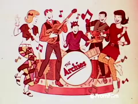 The still features the animated characters from 'The Archies', a fictional band, standing together on stage. They are surrounded by musical notes, with each character engaged in playful musical activity—playing instruments and dancing. The overall vibe is fun and energetic, capturing the iconic 1960s style. The Archies' logo is prominently displayed on a large drum in the center. The scene evokes a sense of nostalgia for both the band and the cereal promotion.
