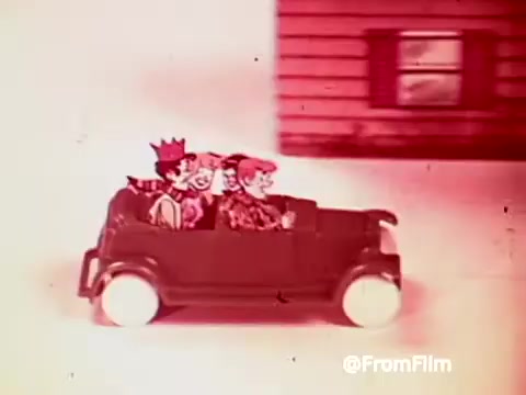 The still features animated characters from the Archie Comics riding in a small car. There are three characters visibly enjoying a ride, with a simple, colorful background suggesting a lively scene. The vintage aesthetic reflects 1960s animation style, typical of commercials aimed at children, promoting the Archies Alpha Bits cereal.