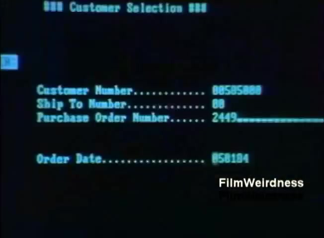 The still features a computer screen displaying a menu titled 'Customer Selection.' It shows fields for customer number, ship-to number, purchase order number, and order date, indicating a transaction or order processing interface typical of business software. The background is black with blue text, characteristic of early computer displays, highlighting the era of IBM's System 36 usage in 1984.