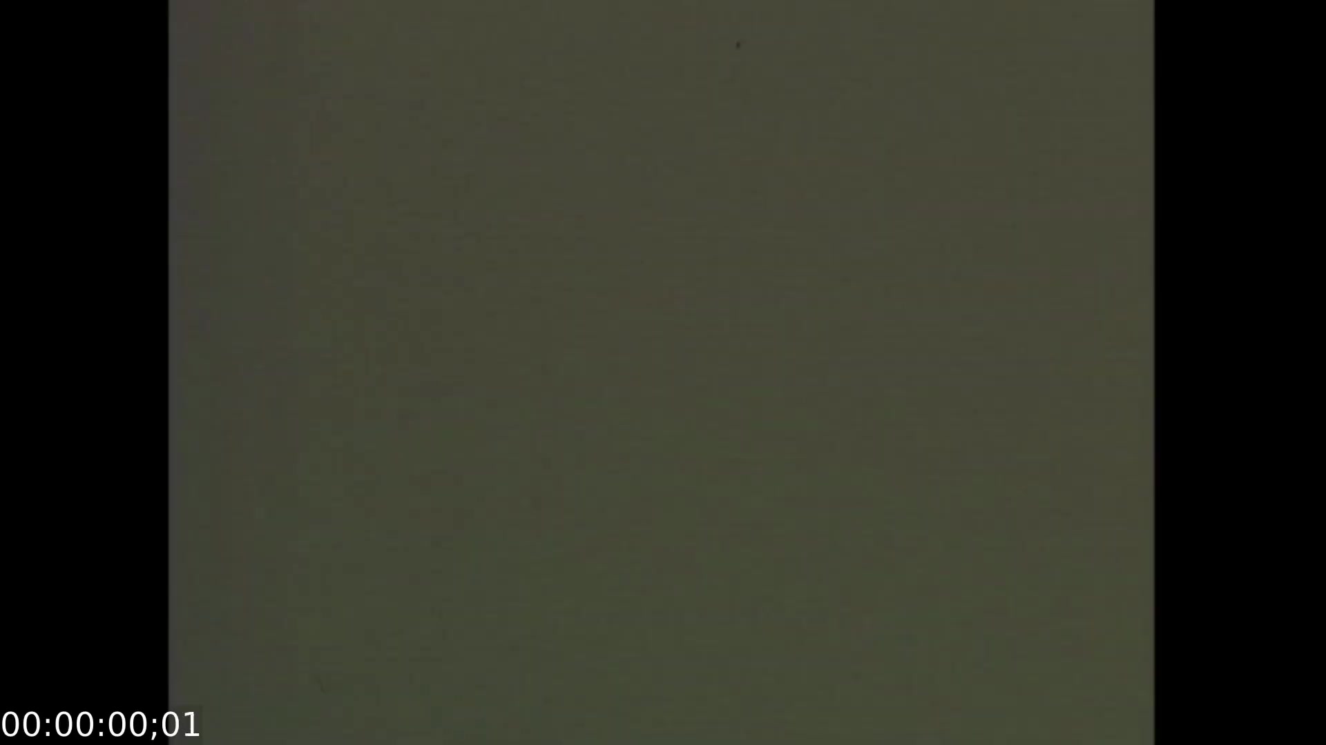 The still from 'Feelings of Depression' (1950) presents a subdued, muted background, evoking a sense of melancholy reflective of the film's themes. As an educational dramatization, it focuses on the emotional struggles of John Murray, a conscientious businessman, highlighting issues related to depression in a post-war context. The film aims to raise awareness about mental health and early emotional awareness, making it a significant piece in the history of educational cinema in Canada.