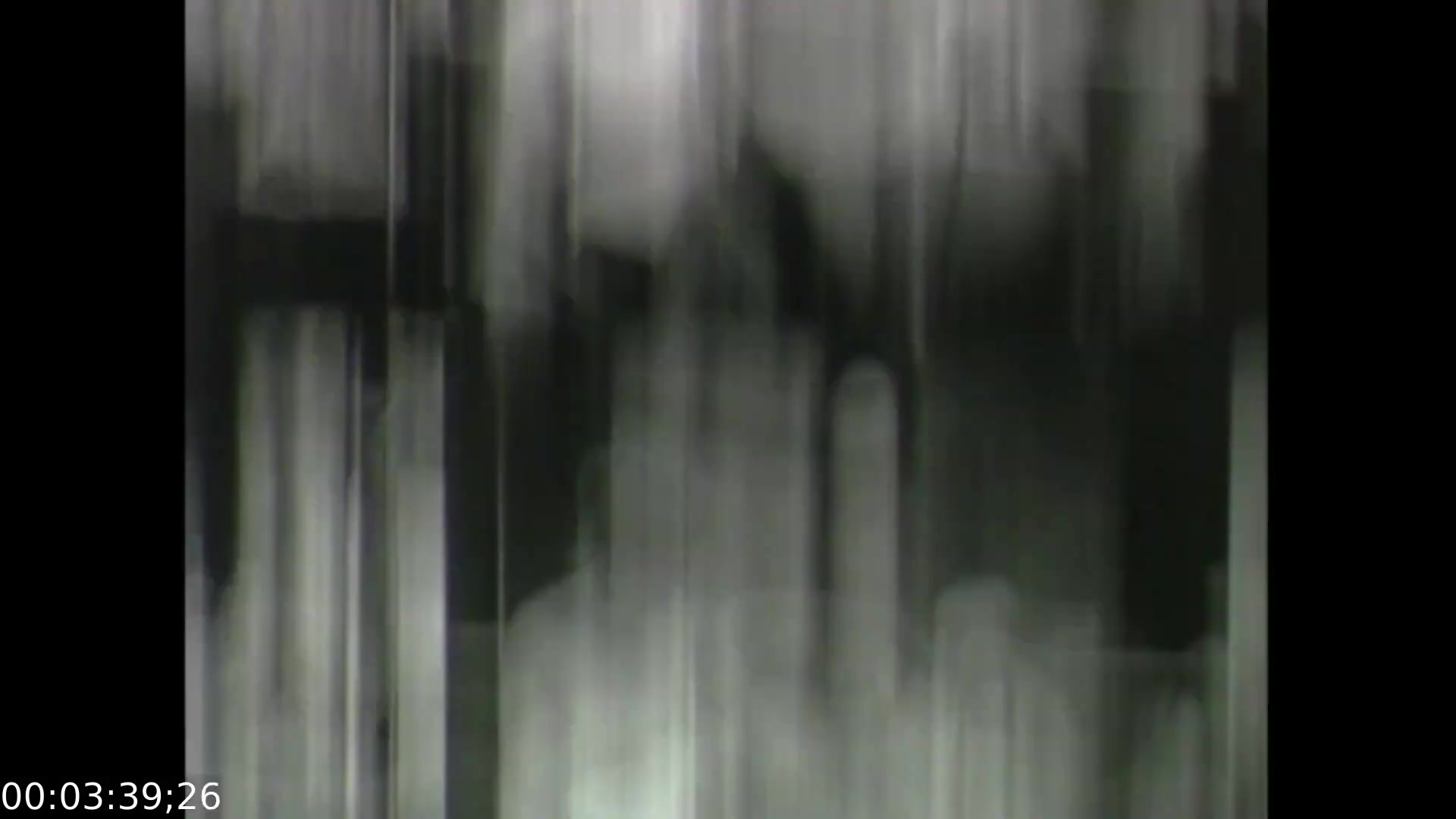 The still from 'Feelings of Depression' (1950) depicts a visually abstract representation, likely using blurred and distorted imagery to convey the emotional turmoil experienced by John Murray, the film's protagonist. This stylistic choice reflects the complexities of depression, illustrating a sense of confusion and despair. The monochromatic palette enhances the somber tone, aligning with the film’s educational aim to raise awareness of mental health issues in a historical context.