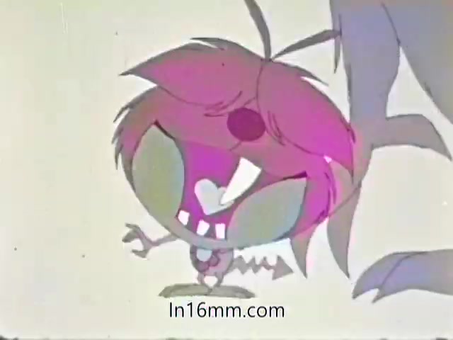 The still from the 'AMA 1968 Flu PSA' features a stylized animated character with bright pink hair and exaggerated facial features. The character has oversized, expressive eyes and a wide smile, conveying a playful and energetic vibe. The background is simple and light-colored, emphasizing the character's vibrant palette. The overall tone suggests a fun and engaging approach to conveying important health information.