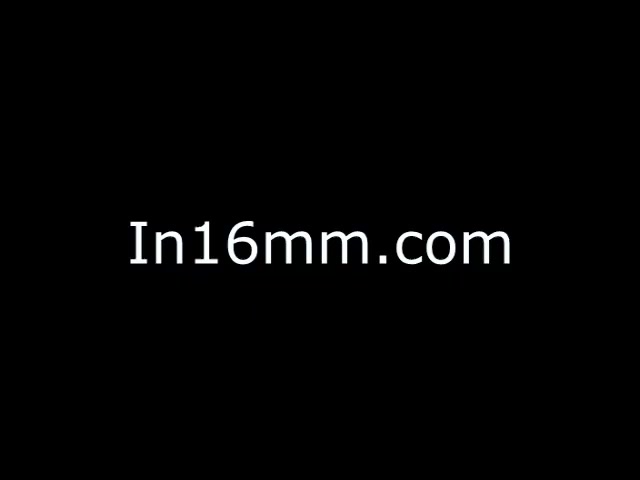 The image is a black screen with the text 'In16mm.com' displayed prominently. There are no visible subjects or setting elements, and the camera angle is not applicable in this context since it features only text on a solid background.