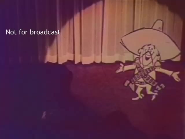 The still features a cartoon character, the Frito Bandito, standing center stage with a vibrant smile and arms wide open. He wears a large sombrero and a bandolier, against a backdrop of curtain drapes. The image has been colorized, enhancing its visual appeal, and includes a watermark indicating it is not for broadcast. The overall tone suggests a playful, nostalgic ambiance linked to vintage animated advertising.