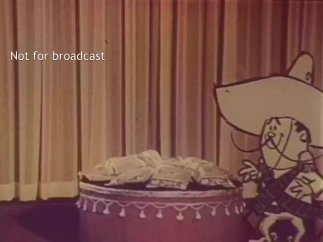 The still features the animated character Frito Bandito, standing next to a circular table piled with bags of Frito chips. The background consists of stage curtains, suggesting a performance setting. The image has a vintage look, likely from the original 16mm film, but has been colorized using Magix Vegas 19. A text overlay indicates that it is 'Not for broadcast.'