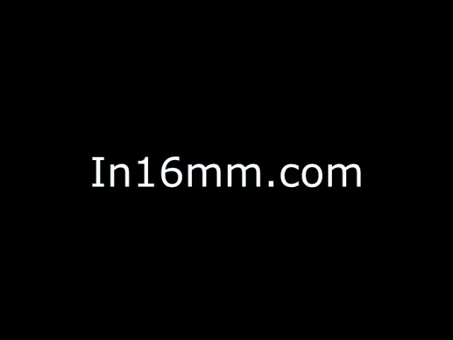 The still features a black background with the text 'In16mm.com' prominently displayed in white. It suggests a digital or film-related context, possibly indicating the source or hosting site for the content. The text implies a focus on 16mm film, potentially as a tribute or showcase.