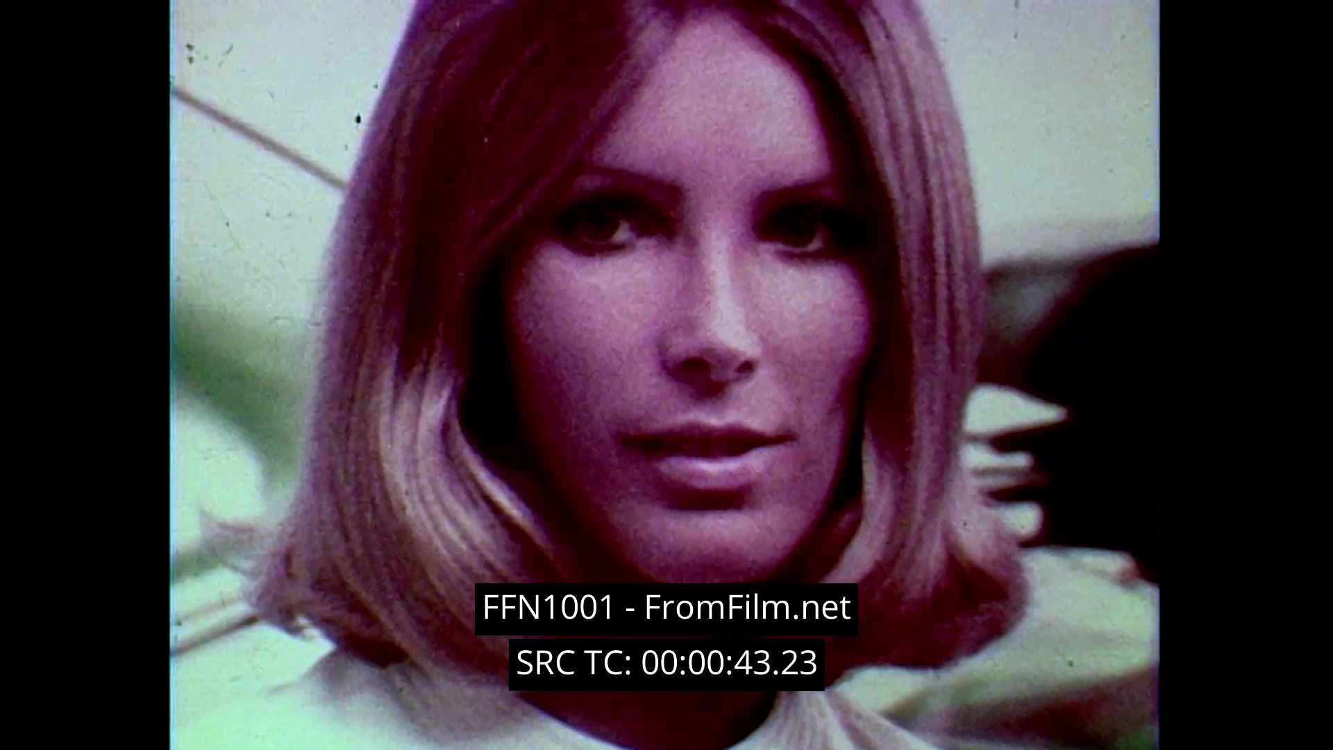 This 16mm still from Chanel No. 5: 'Tomorrow’s Woman' showcases a dreamy advertisement for Chanel No. 5, featuring a model with textured, softly lit hair and a serene expression. The 1970s aesthetic is prominent, enhanced by soft-focus close-ups of the iconic perfume bottle, evoking a lush and ethereal atmosphere. The overall imagery captures the elegance and allure associated with the Chanel brand.